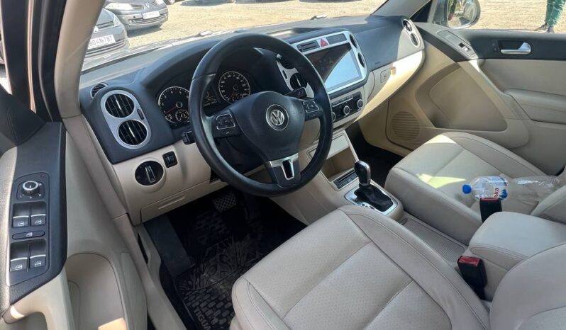 
								2011  VOLKSWAGEN Tiguan заповнено									